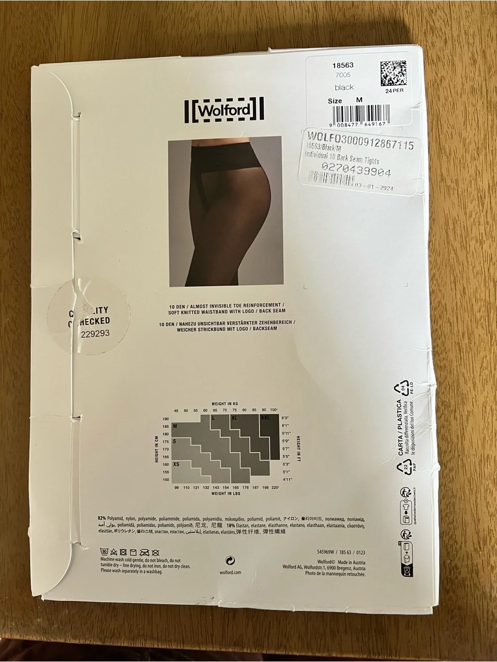 Wolford individual 10 back seam tights size M. Never worn in package. Black